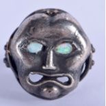 A SILVER AND OPAL MASK RING. N.
