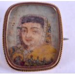 A 19TH CENTURY INDIAN GOLD MOUNTED IVORY BROOCH. 2.25 cm square.