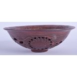 A CHINESE RETICULATED YIXING POTTERY BOWL. 15 cm wide.