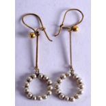 A PAIR OF EDWARDIAN GOLD AND PEARL EARRINGS.