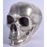 A SILVER PLATED SCULPTURE OF A SKULL. 10.5 cm x 12 cm.