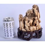A CHINESE QING DYNASTY CARVED IVORY FIGURE OF A SEATED BUDDHA, together with hardwood stand. 21 cm x