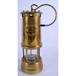 A BRASS MINERS LAMP. 31 cm high.