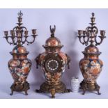 A LARGE 19TH CENTURY JAPANESE EDO PERIOD IMARI CLOCK GARNITURE with French bronze lion head mask hea