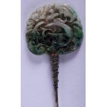 AN EARLY 20TH CENTURY CHINESE CARVED JADEITE AND SILVER HAIR PIN. 16 cm long.