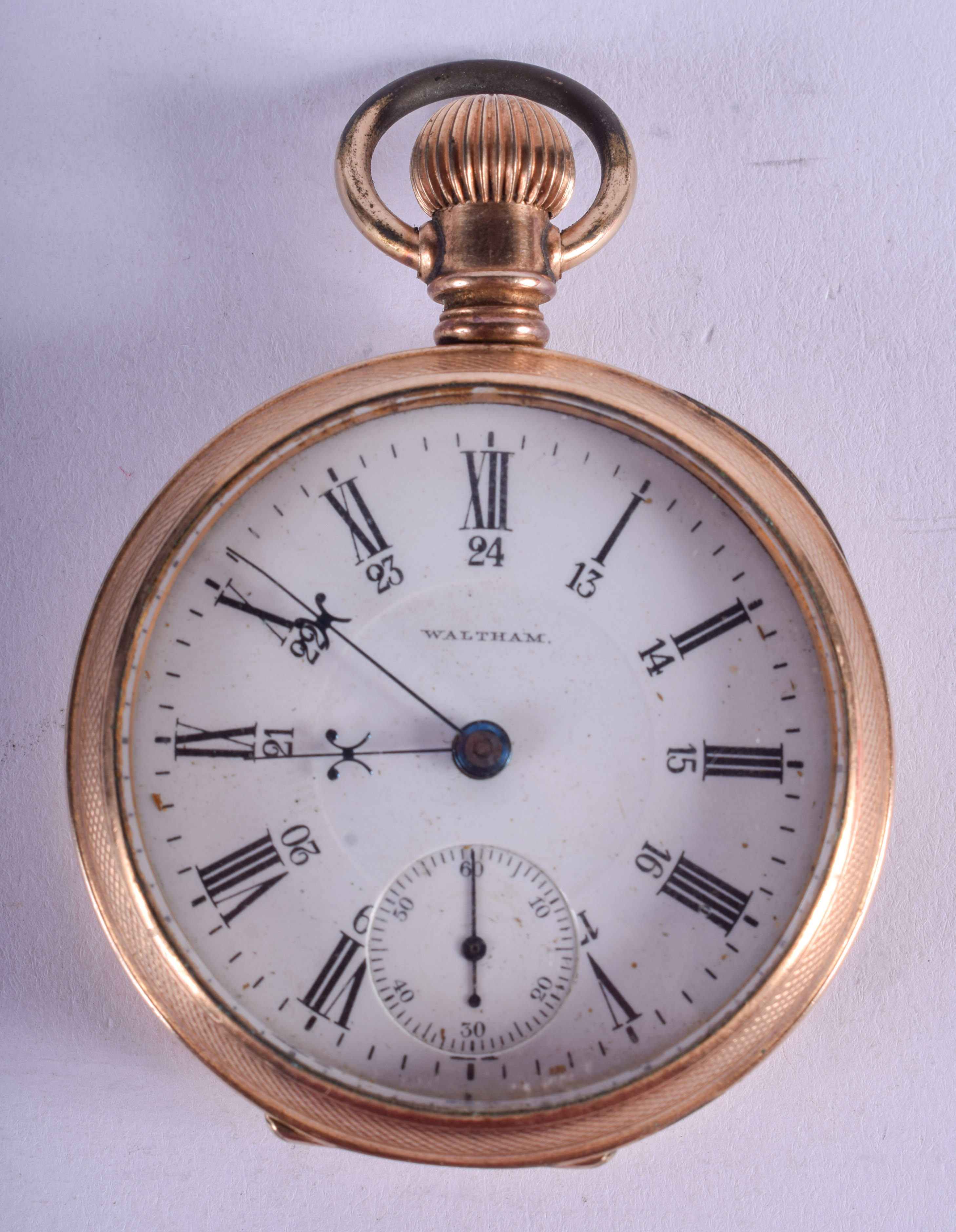 AN ANTIQUE GOLD PLATED WALTHAM POCKET WATCH. 5.25 cm wide.