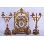 A 19TH CENTURY FRENCH GILT METAL AESTHETIC MOVEMENT CLOCK GARNITURE modelled in the Japanese style.