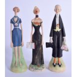 A SET OF 1920S GROTESQUE LONG ARMED BISQUE PORCELAIN FIGURES. 20 cm high. (3)