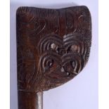 A VINTAGE TRIBAL NEW ZEALAND MAORI CARVED WOOD TEWHATEWHA CLUB with mother of pearl inlaid eyes. 120