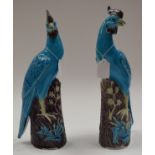 A PAIR OF EARLY 20TH CENTURY CHINESE TURQUOISE GLAZED HOHO BIRDS Late Qing/Republic. 36 cm high.