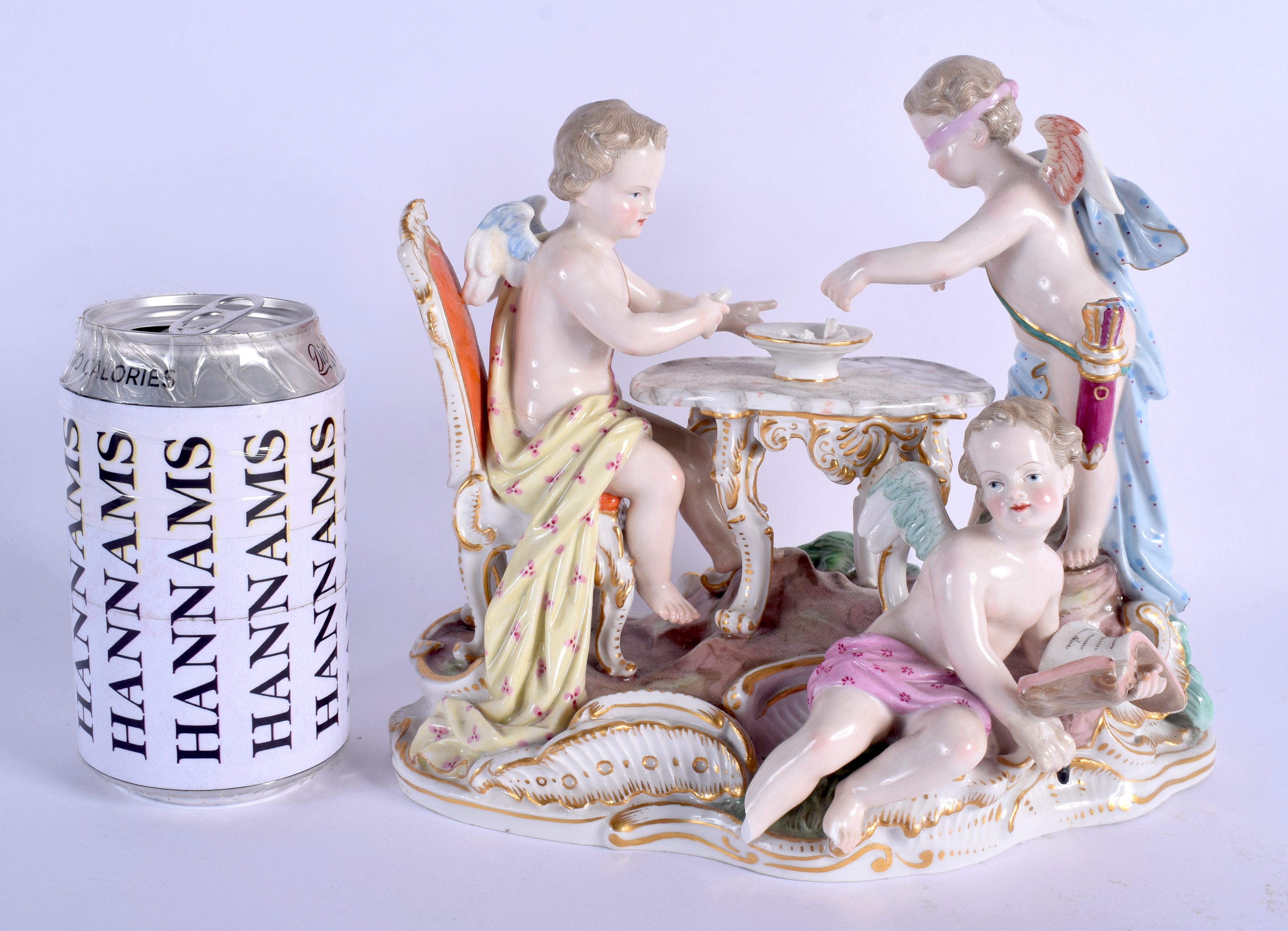 A LARGE 19TH CENTURY MEISSEN PORCELAIN FIGURAL GROUP modelled as putti playing blind mans bluff upon