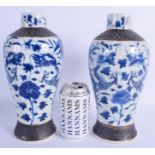 A PAIR OF 19TH CENTURY CHINESE BLUE AND WHITE VASES painted with dragons. 27 cm high.