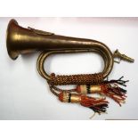 A MILITARY BRASS HORN. 25 cm wide.