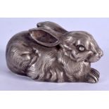 AN UNUSUAL CONTINENTAL SILVER MODEL OF A RECUMBENT HARE. 1.7 oz. 7 cm x 3.5 cm.