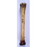 AN EARLY CONTINENTAL CARVED BONE PESTLE. 19 cm long.