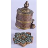 AN EARLY 20TH CENTURY TIBETAN COPPER PRAYER WHEEL and a turquoise mounted pendant. (2)