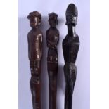 THREE EARLY 20TH CENTURY AFRICAN TRIBAL CARVED HARDWOOD STAFF. Largest 90 cm long. (3)