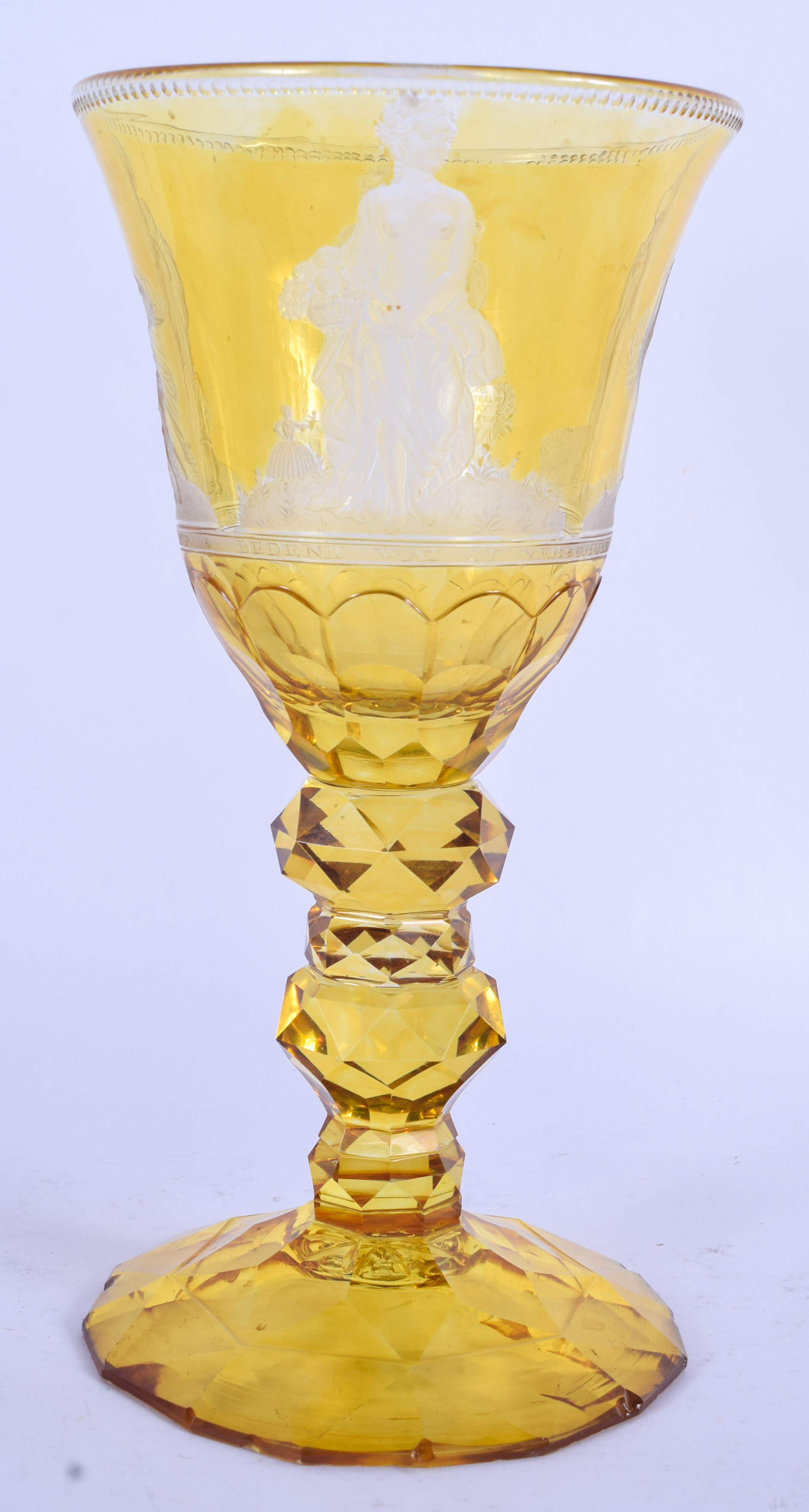 A FINE 18TH/19TH CENTURY BOHEMIAN AMBER GLASS GOBLET wonderfully carved with figures within landscap