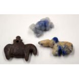 THREE CENTRAL ASIAN STONE AMULETS. (3)