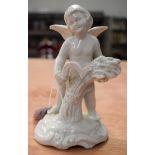 A DRESDEN CHERUB. 7 cm high.