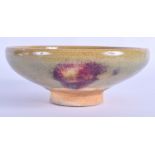 A 19TH CENTURY CHINESE JUNYAO GLAZED POTTERY BOWL with purple splash decoration. 14 cm wide.