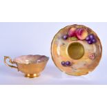 A ROYAL WORCESTER FRUIT PAINTED SCALLOPED CUP AND SAUCER. Saucer 14.5 cm wide. (2)