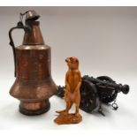 A LARGE MIDDLE EASTERN COPPER EWER together with a cannon and figure. (3)