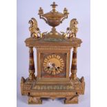 A RARE 19TH CENTURY FRENCH EGYPTIAN REVIVAL POTTERY AND BROZE MANTEL CLOCK painted with classical fi