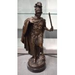 A LARGE CONTEMPORARY BRONZE FIGURE OF A ROMAN SOLIDER modelled wearing mask head armour. 64 cm high.