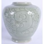 A 19TH CENTURY CHINESE CELADON VASE Qing, decorated with foliage. 19 cm x 13 cm.