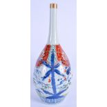 A 19TH CENTURY JAPANESE EDO PERIOD IMARI PORCELAIN BOTTLE VASE painted with foliage. 30 cm high.