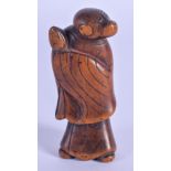 A GOOD 18TH/19TH CENTURY JAPANESE EDO PERIOD BOXWOOD NETSUKE possibly representing a monkey priest.