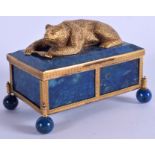 A RARE CONTINENTAL SILVER GILT AND LAPIS LAZULI BOX AND COVER formed with a recumbent bear holding a