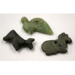 THREE CENTRAL ASIAN STONE AMULETS. (3)