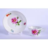 AN UNUSUAL ANTIQUE MEISSEN PORCELAIN CUP AND SAUCER painted with floral sprays. (2)