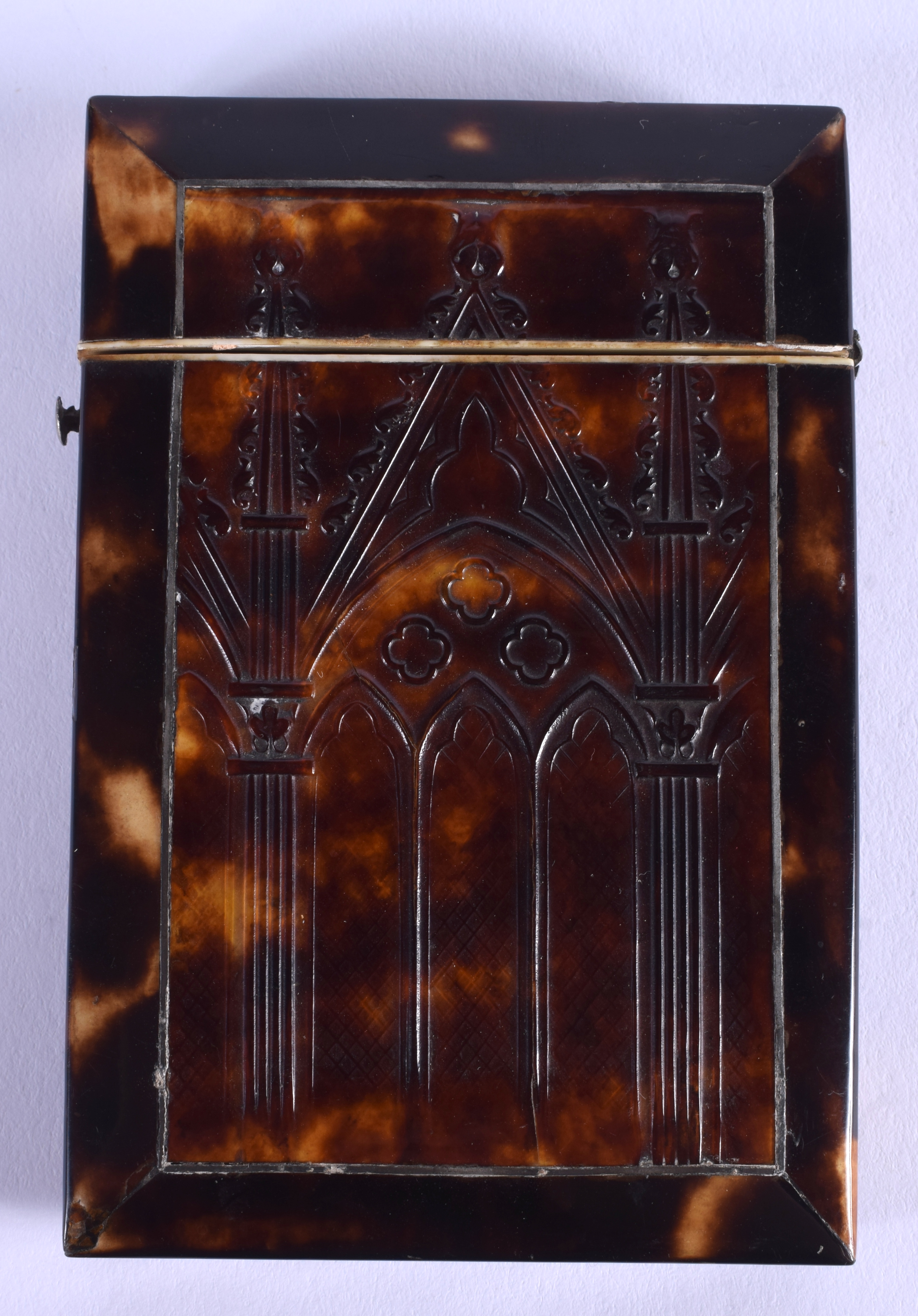 A REGENCY PRESSED TORTOISESHELL CARD CASE AND COVER depicting a building. 7.5 cm x 9 cm.