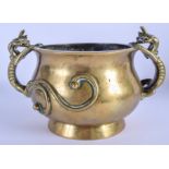 A LARGE 19TH CENTURY CHINESE TWIN HANDLED BRONZE CENSER bearing Xuande marks to base, with stylised