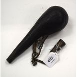 AN ANTIQUE LEATHER MOUNTED POWDER FLASK. 24 cm long.