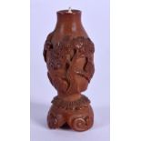 A 19TH CENTURY CONTINENTAL CARVED COQUILLA NUT SNUFF BOTTLE decorated with landscapes. 4 cm high.