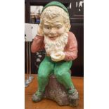 A VINTAGE PAINTED COMPOSITE GARDEN GNOME. 48 cm x 23 cm.