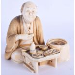 A 19TH CENTURY JAPANESE MEIJI PERIOD CARVED IVORY OKIMONO modelled as a seated artisan. 9 cm x 9 cm.