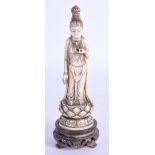 A 19TH CENTURY JAPANESE MEIJI PERIOD CARVED IVORY BUDDHISTIC FEMALE modelled upon a lotus base. Ivor