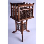 AN ANTIQUE MOORISH LIBERTY STYLE CARVED WOOD MAGAZINE RACK. 71 cm x 38 cm.