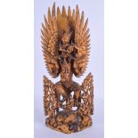 A 19TH CENTURY SOUTH EAST ASIAN GILTWOOD FIGURE OF A BUDDHISTIC GOD modelled with a winged maiden up