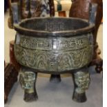 A LARGE EARLY 20TH CENTURY CHINESE TWIN HANDLED BRONZE CENSER Archaic style, decorated with calligra