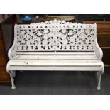 AN ANTIQUE PAINTED METAL GARDEN BENCH modelled in the Coalbrookdale style. 130 cm x 82 cm.