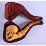 A RARE 19TH CENTURY CARVED AMBER SKULL PIPE possibly a representation of Shakespeare. 15 cm x 5 cm.