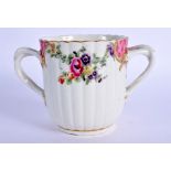 AN 18TH CENTURY WORCESTER CHOCOLATE CUP of rare shape, decorated with flowers. 8 cm x 8 cm.