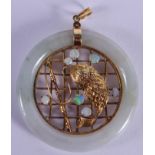 AN EARLY 20TH CENTURY CHINESE GOLD OPAL AND JADEITE PENDANT modelled as a caught fish. 5 cm wide.