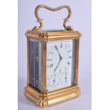 A 19TH CENTURY FRENCH REPEATING BRASS CARRIAGE CLOCK with triple dial. 19 cm high inc handle.